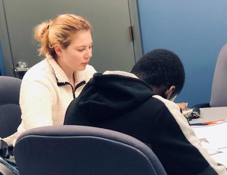 Student being tutored at table