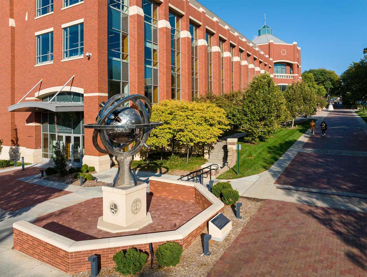 Globe statue in front of Harper Center