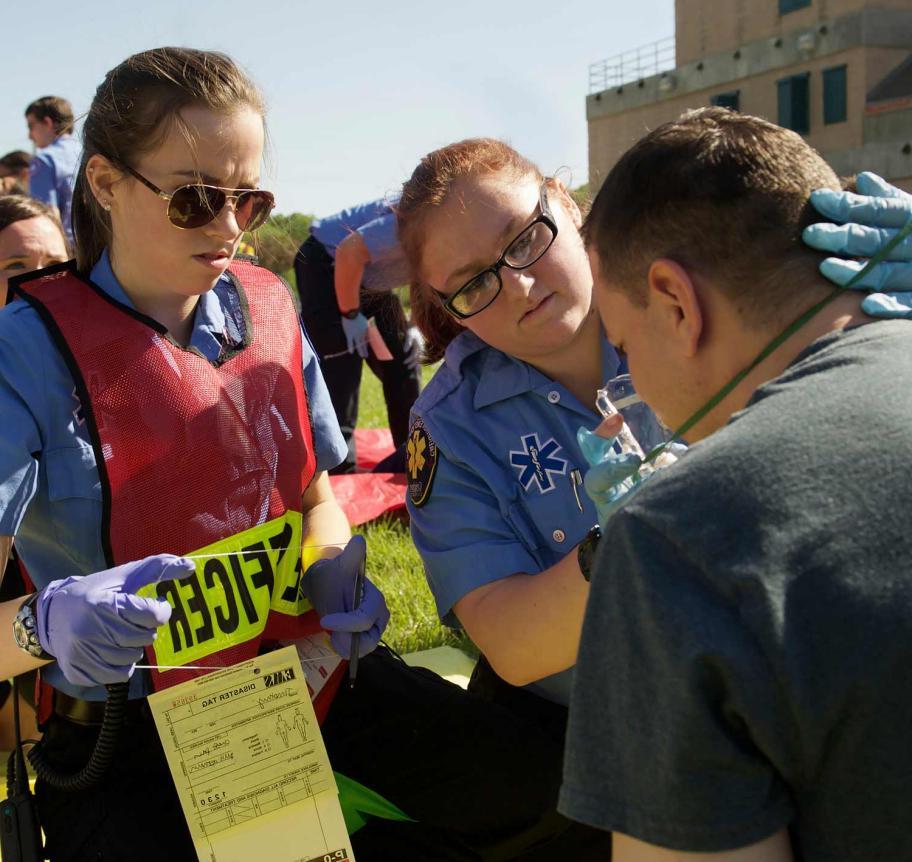 EMS students assessing a patient