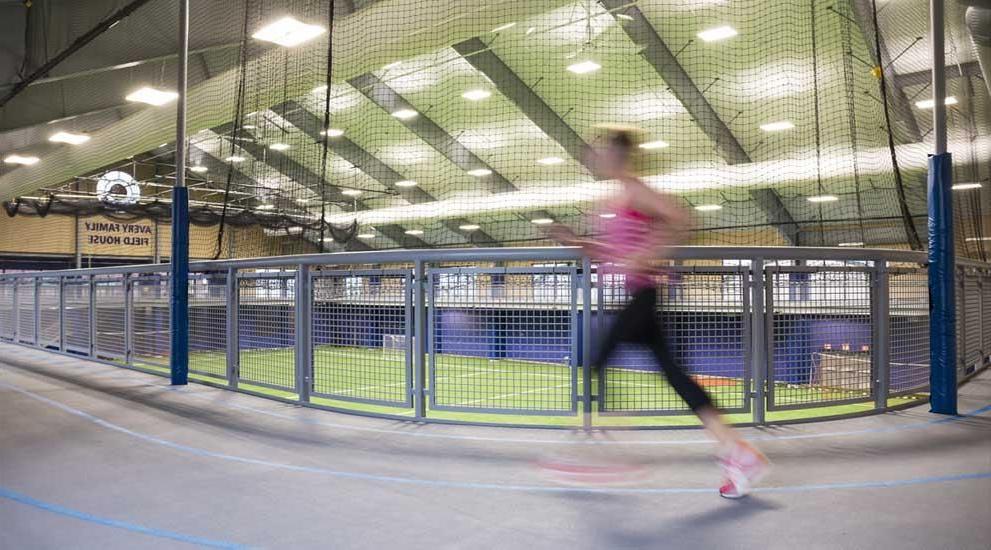 Student running on track.