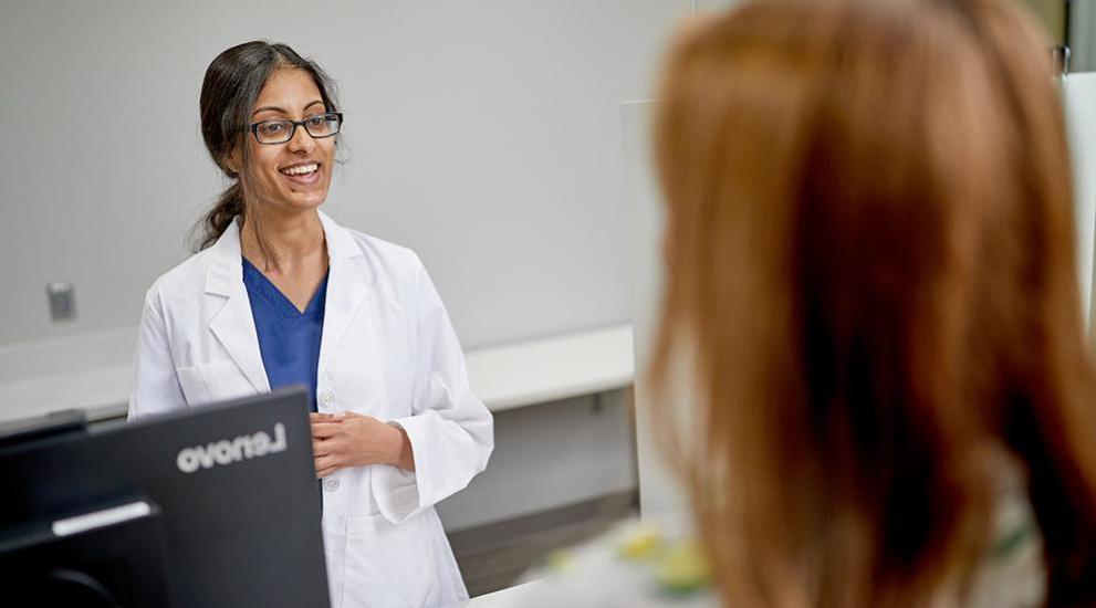 Pharmcist talking with patient